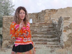 Perverted Helena Volga is really into petting her wet pussy outdoors